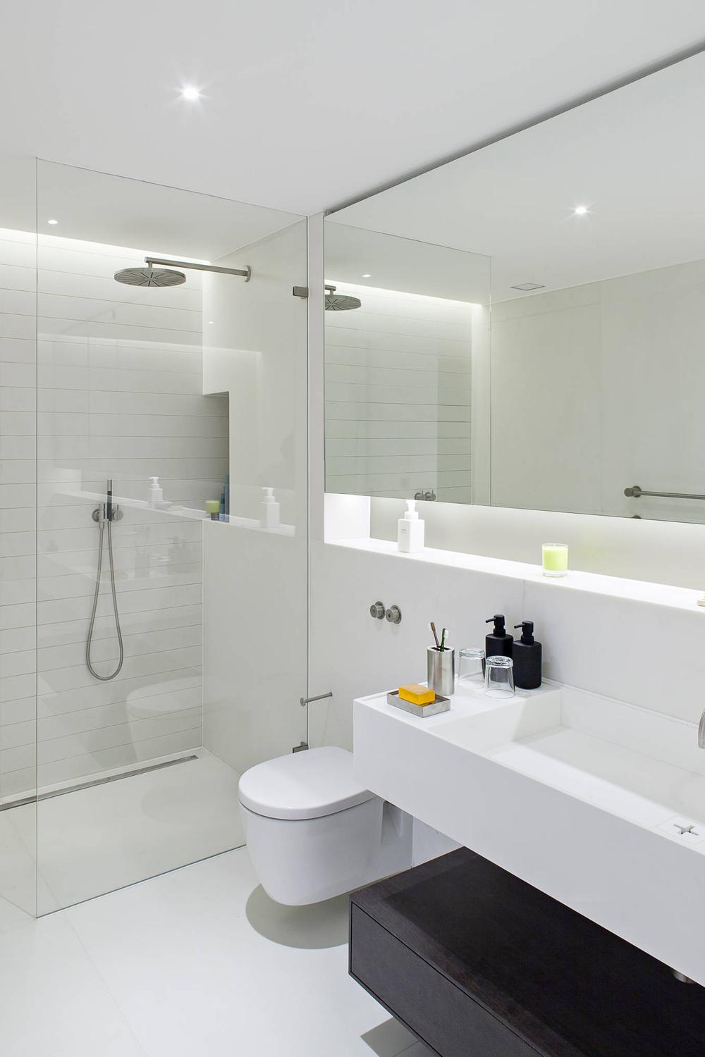 Bright modern bathroom with smart lighting and elegant fixtures