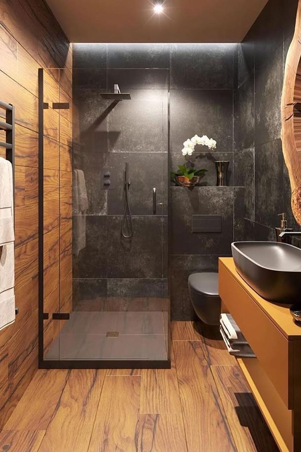 Modern bathroom integrating warm wooden flooring and minimalistic elements for a relaxing retreat.