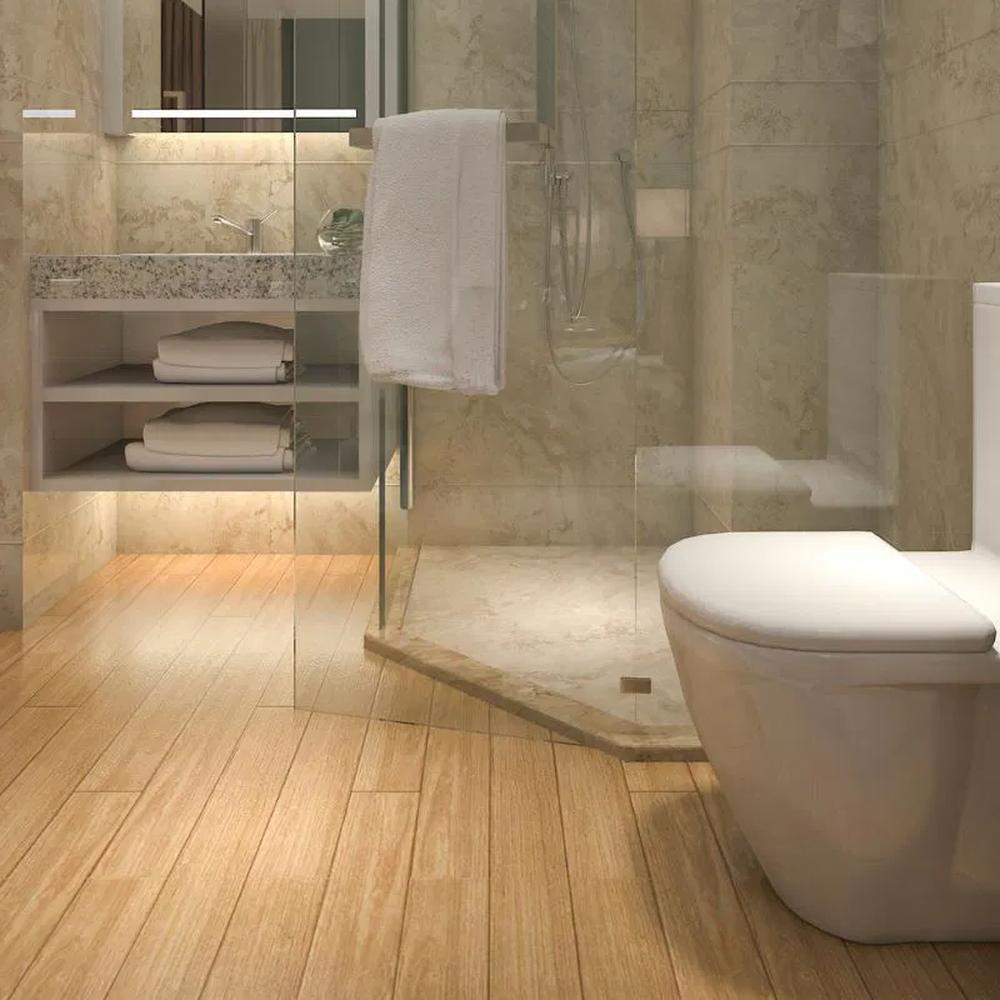Functional bathroom featuring light hardwood flooring, granite vanity, and sleek design.