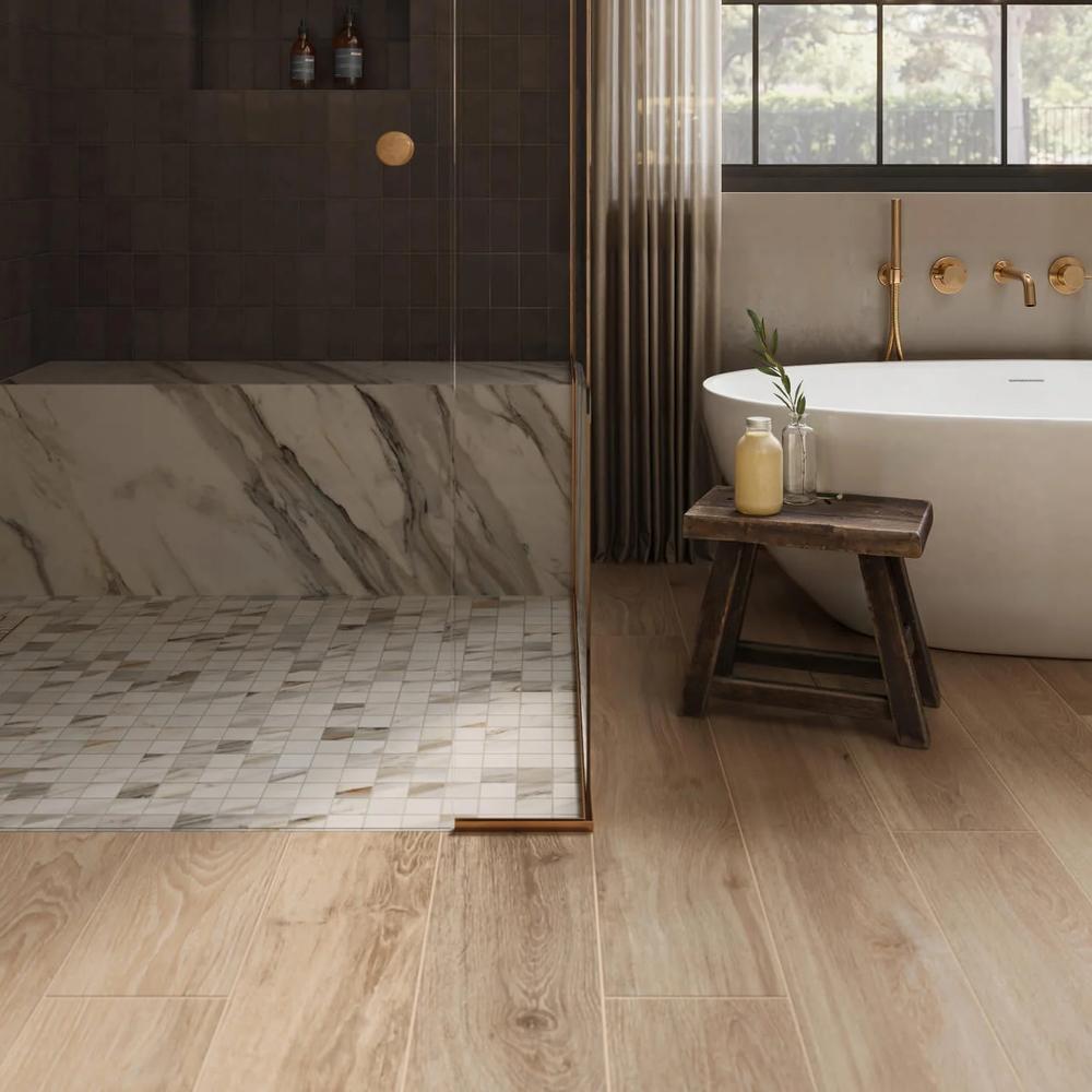 Modern bathroom with warm wood-like tiles, freestanding tub, and elegant gray and white decor.