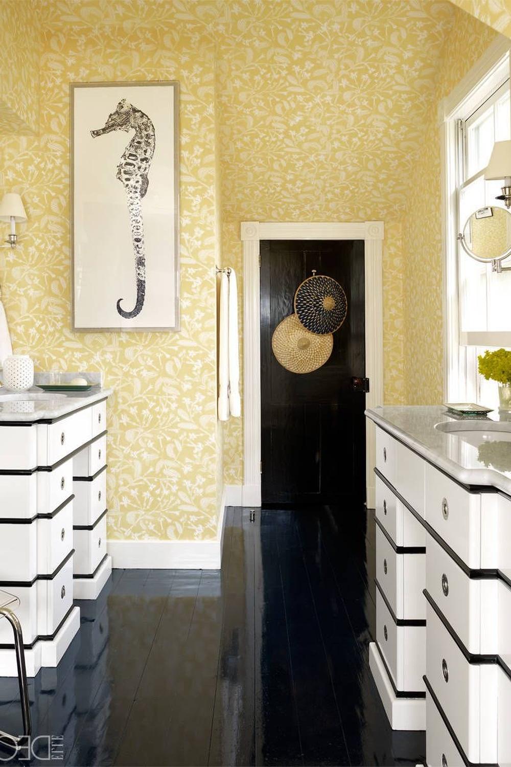 A serene yellow bathroom with floral wallpaper, elegant vanity, and tasteful decor, creating a calming ambiance.