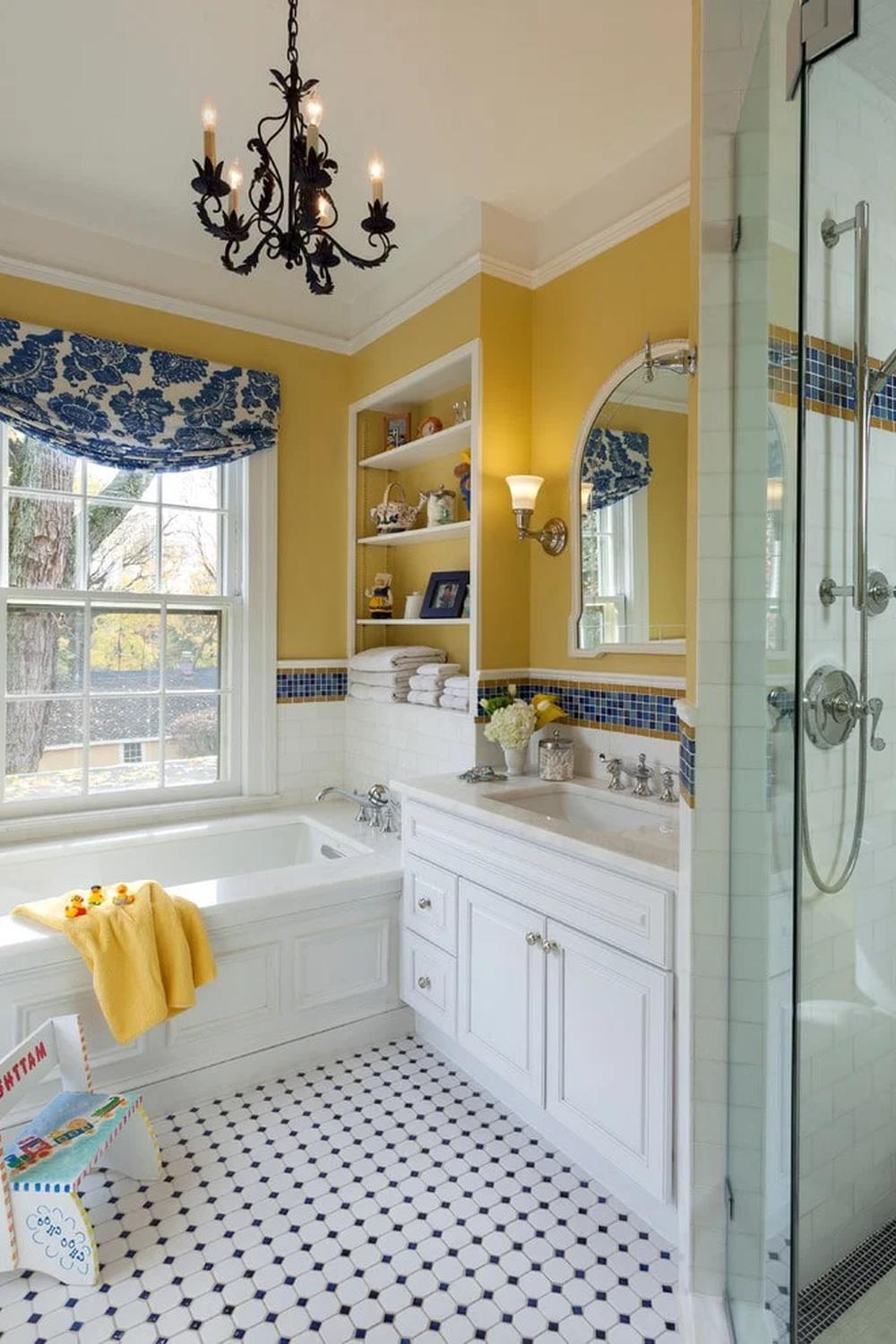 Bright bathroom with yellow walls and stylish lighting