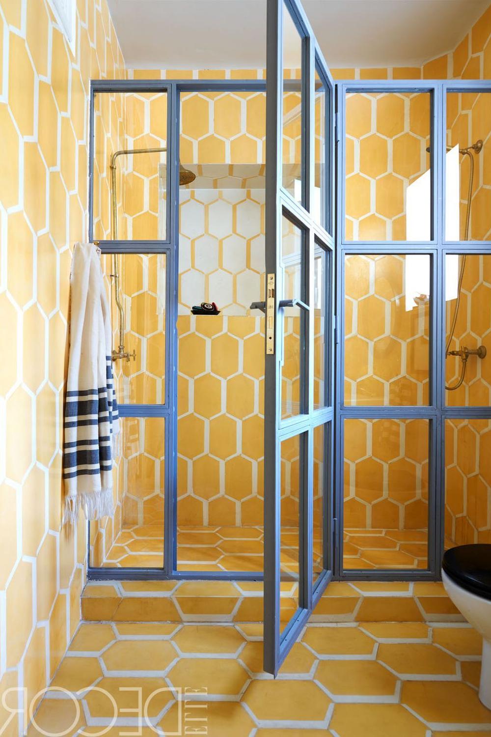 Unique bathroom featuring honeycomb-patterned yellow tiles